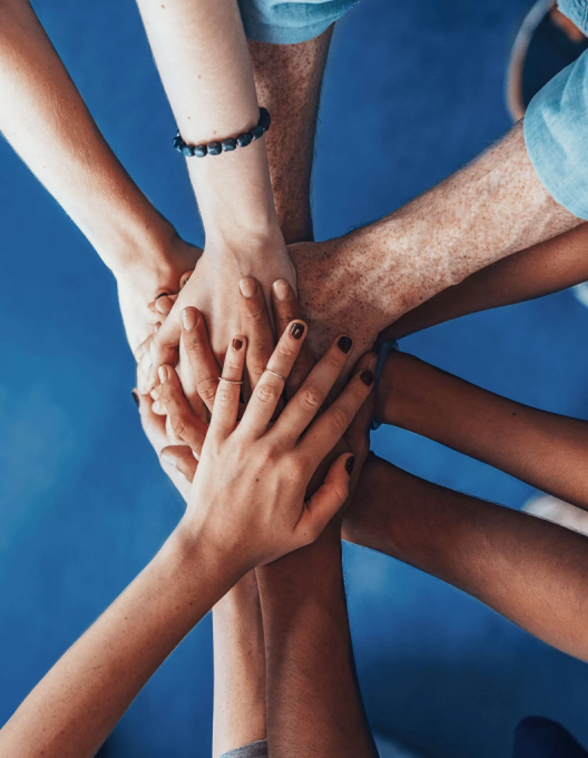 Team collaboration hands stacked together